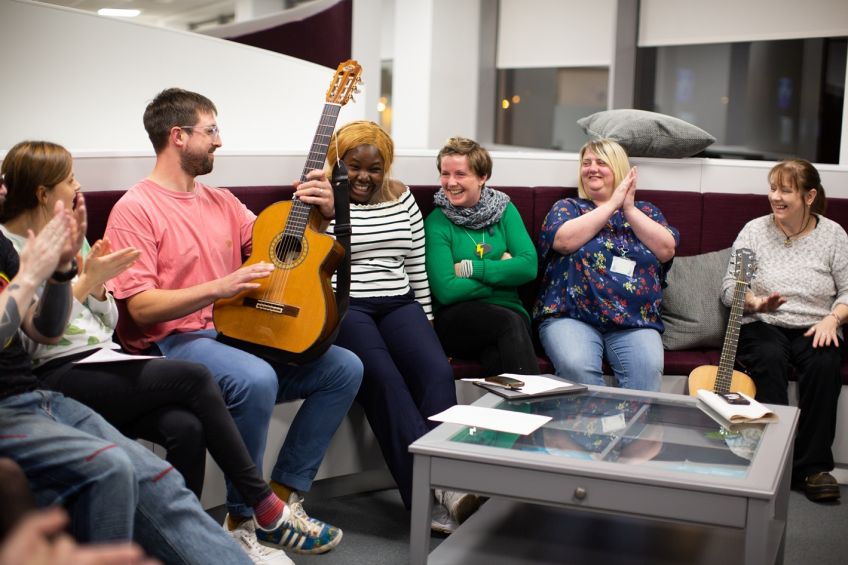 Group of Ensemble musicians laughing