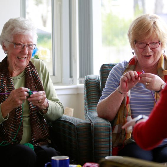 Two customers enjoying their knitting class